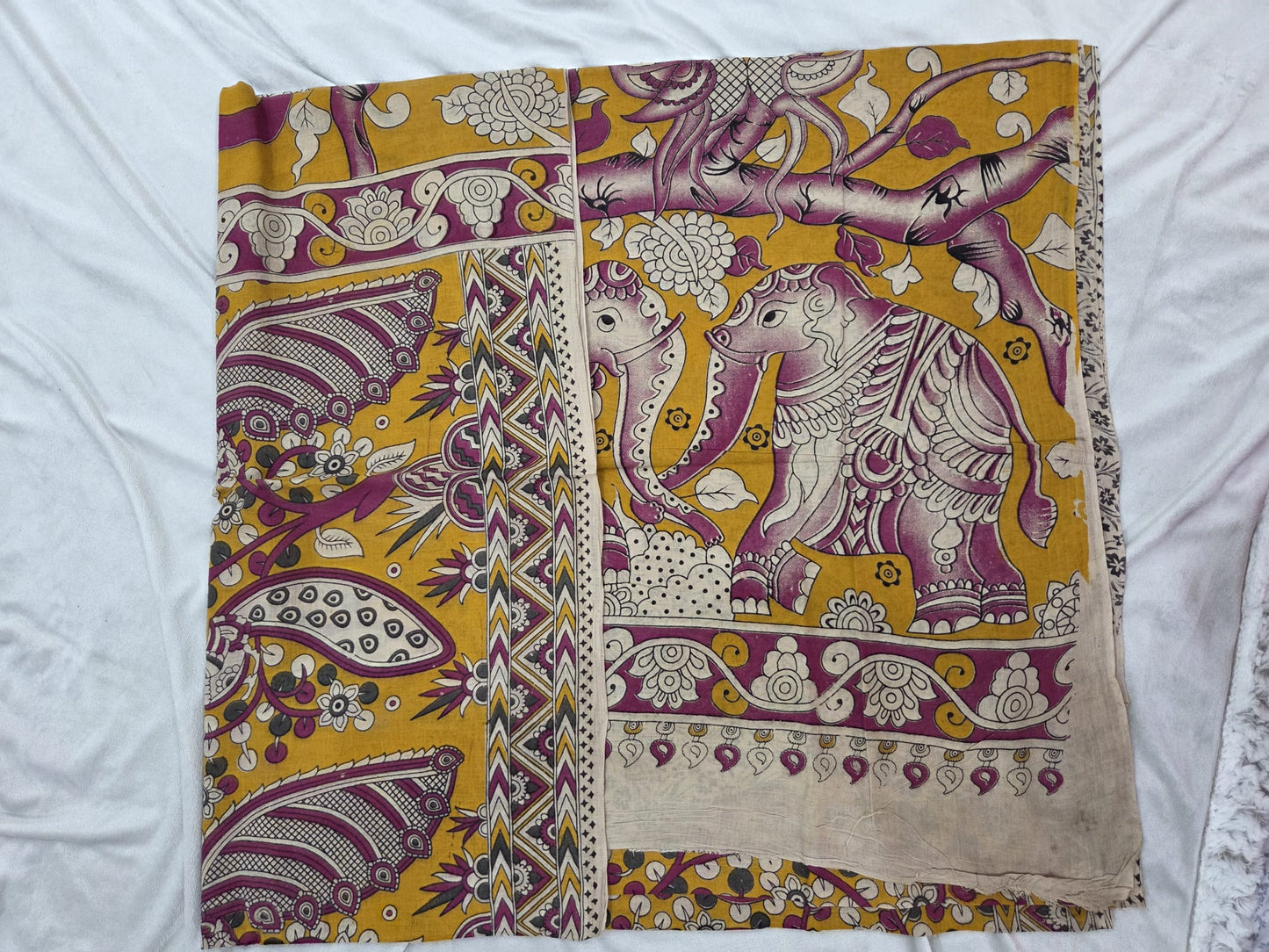 Kalamkari saree with stylized trees, animals (like elephants)